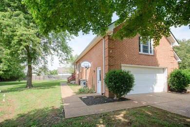 Nice walkway to side garage entry and backyard