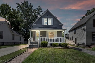 Bungalow-style house with a yard and a porch