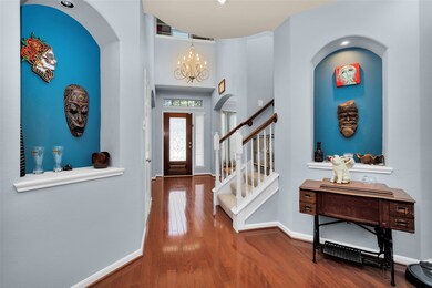 This is a view of the entry way from just inside the living room. Showcasing two perfect art niches to display your art or create family photo walls.