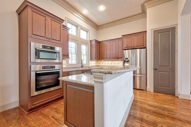 Kitchen opens to breakfast room and formal dining