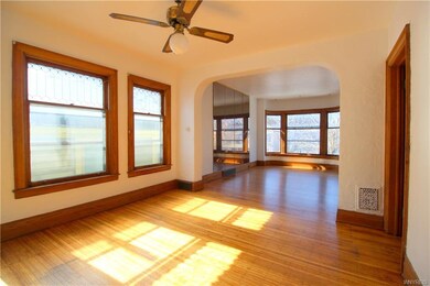 The sun beaming through leaded glass windows onto 
