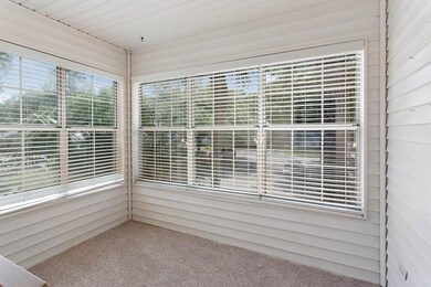 Light drenched sun porch than can be  used as alte