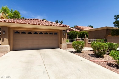 View of front of home with a tile roof, stucco sid