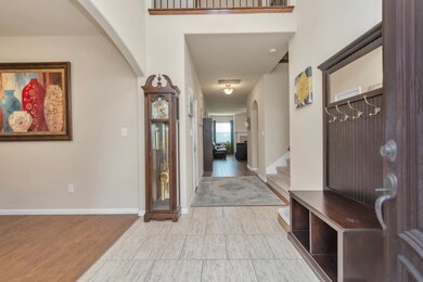 A glimpse into your new home featuring wood flooring and 12x12 upgraded tile!
