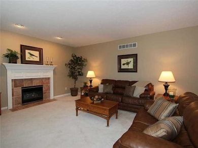 Family Room. Gas log fireplace and beautifully trimmed mantle make this room even more inviting!