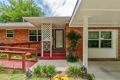Property entrance featuring brick siding