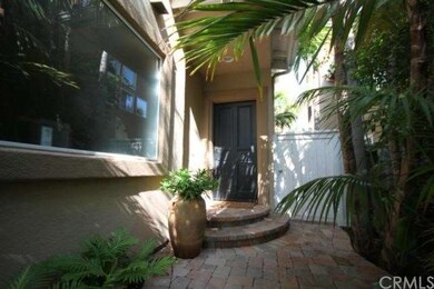Entry to front door showing sidewalk made of paver