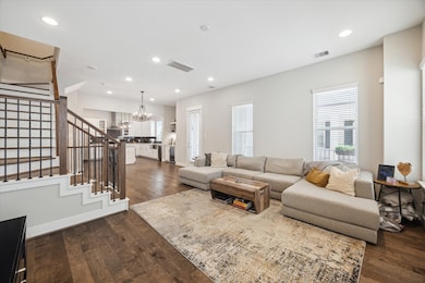 This modern open-concept kitchen and living area i