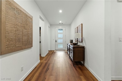 Entryway featuring wood finished floors and recessed lighting