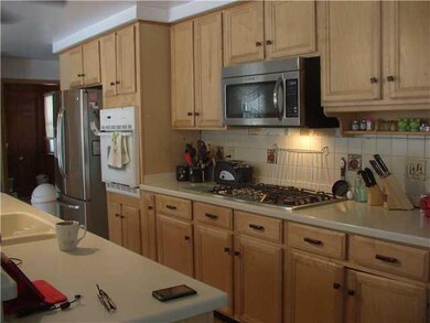 Kitchen Newer maple cabinets with corian counterto