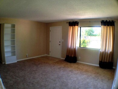 LIVING ROOM WITH BUILT IN BOOK CASE
