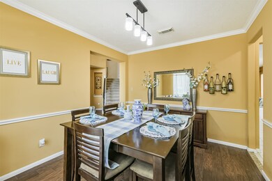 Formal Dining room with new light fixture and chai
