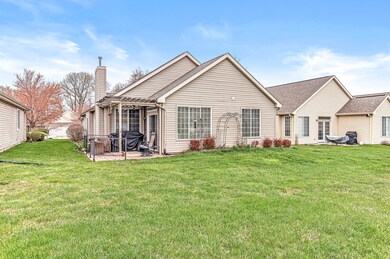 BACK OF HOME SHOWING THE PERGOLA WITH SHADED SCREENING ON THE TOP WITH SIDE SHADES PLENTY OF ROOM FOR YOUR PLANTS AND HANGING BASKETS