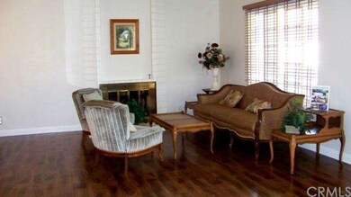 Living Room with large Front window, cozy fireplac