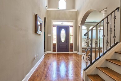 Majestic 2 story Foyer entrance featuring decorati