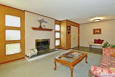 Large living room with brick wood burning fireplac