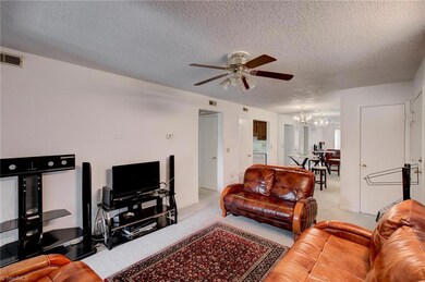 Alternate view of living room and dining area.
