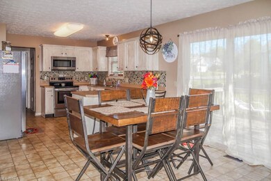 The dinette has sliding door to the back deck.