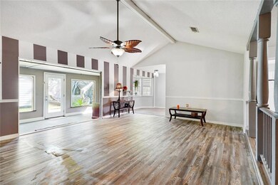 View from foyer, looking into living room, sun roo