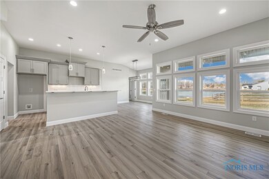 This kitchen is open to the living and dining area