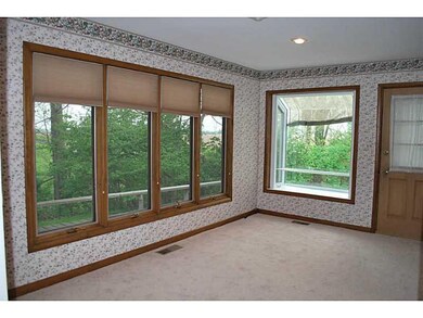 Dining Room. Greenhouse window at the end of the dining room, door on right goes out to a screened in deck.