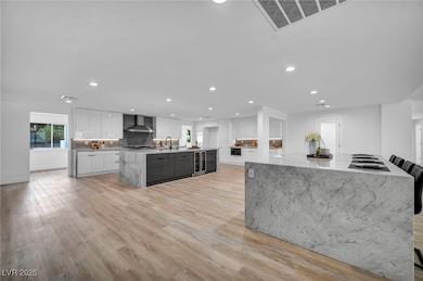 Kitchen with modern cabinets, wall chimney exhaust