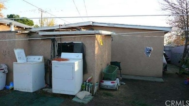 BEHIND THE WASHER AND DRYER IS THE STRUCTURE FOR L