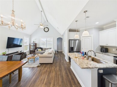Kitchen with dark wood finished floors, a sink, ce