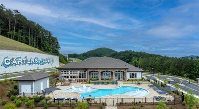 Community pool with a patio