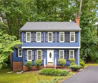 Featuring a newer roof and freshly painted exterior (and new sleek black gutters).