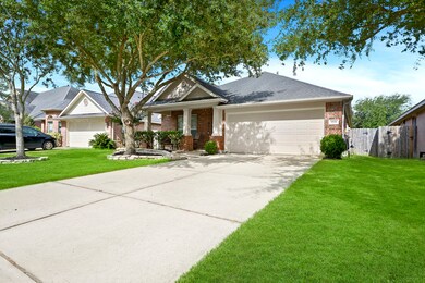 Long driveway up to the 2 car garage. Mature trees offered.