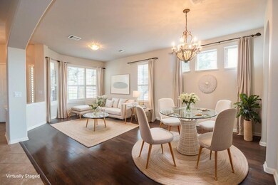 Dining room featuring visible vents, an inviting 