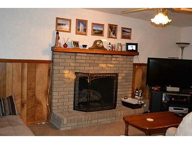 Family Room. Gas log brick fireplace with raised h