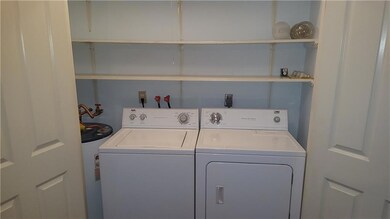 Laundry Room off foyer with w/d hookups, hot water
