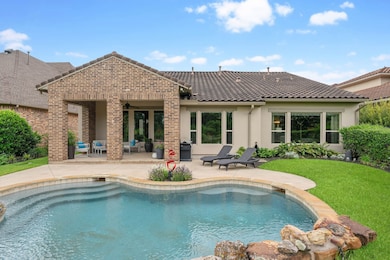 Beautiful backyard retreat featuring a sparkling p