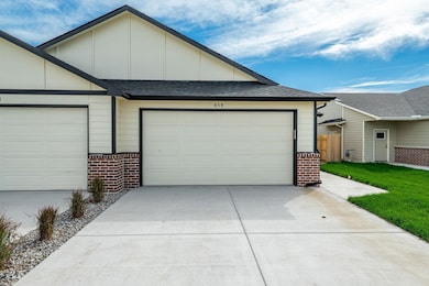 Garage featuring driveway