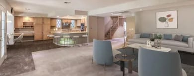 Lobby featuring stairway and recessed lighting