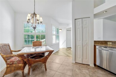 Your morning room off the kitchen, chandelier, granite countertops, and stainless steel dishwasher. Entire condo has been freshly painted.