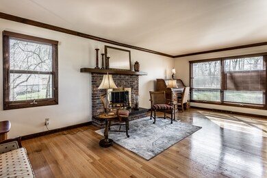 Enjoy the ambiance and ease of a gas-log fireplace with classic brick surround.