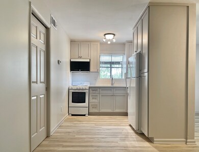 Kitchen separated from the living spaces