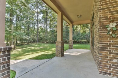 Oversized front porch. Wooded entrance.