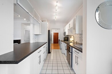 The remodeled kitchen features a masterfully craft