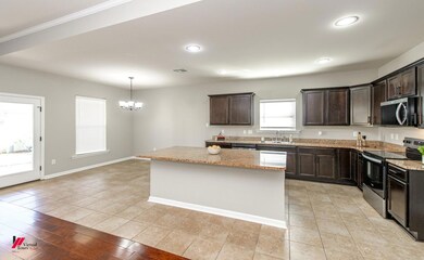 Kitchen featuring an inviting chandelier, light st