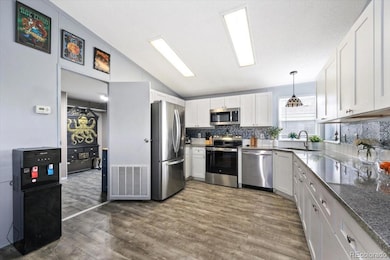 Kitchen looking into huge laundry room
