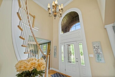 Enter through the beveled glass front door into an