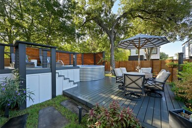 Deck with a fenced backyard and outdoor dining sp
