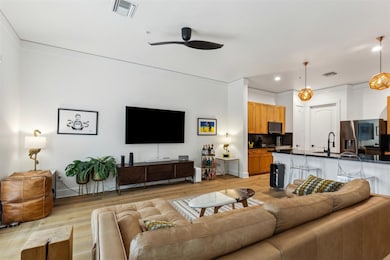 Living area with light wood finished floors, visib
