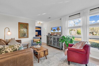Living room featuring a textured ceiling, hardwood