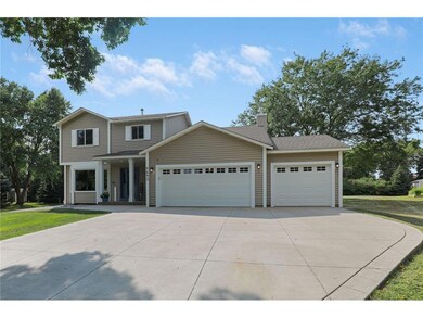 Welcoming front porch & oversized 3-car driveway