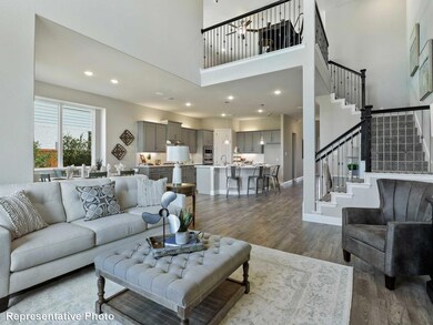 Living room with a high ceiling, dark hardwood / w